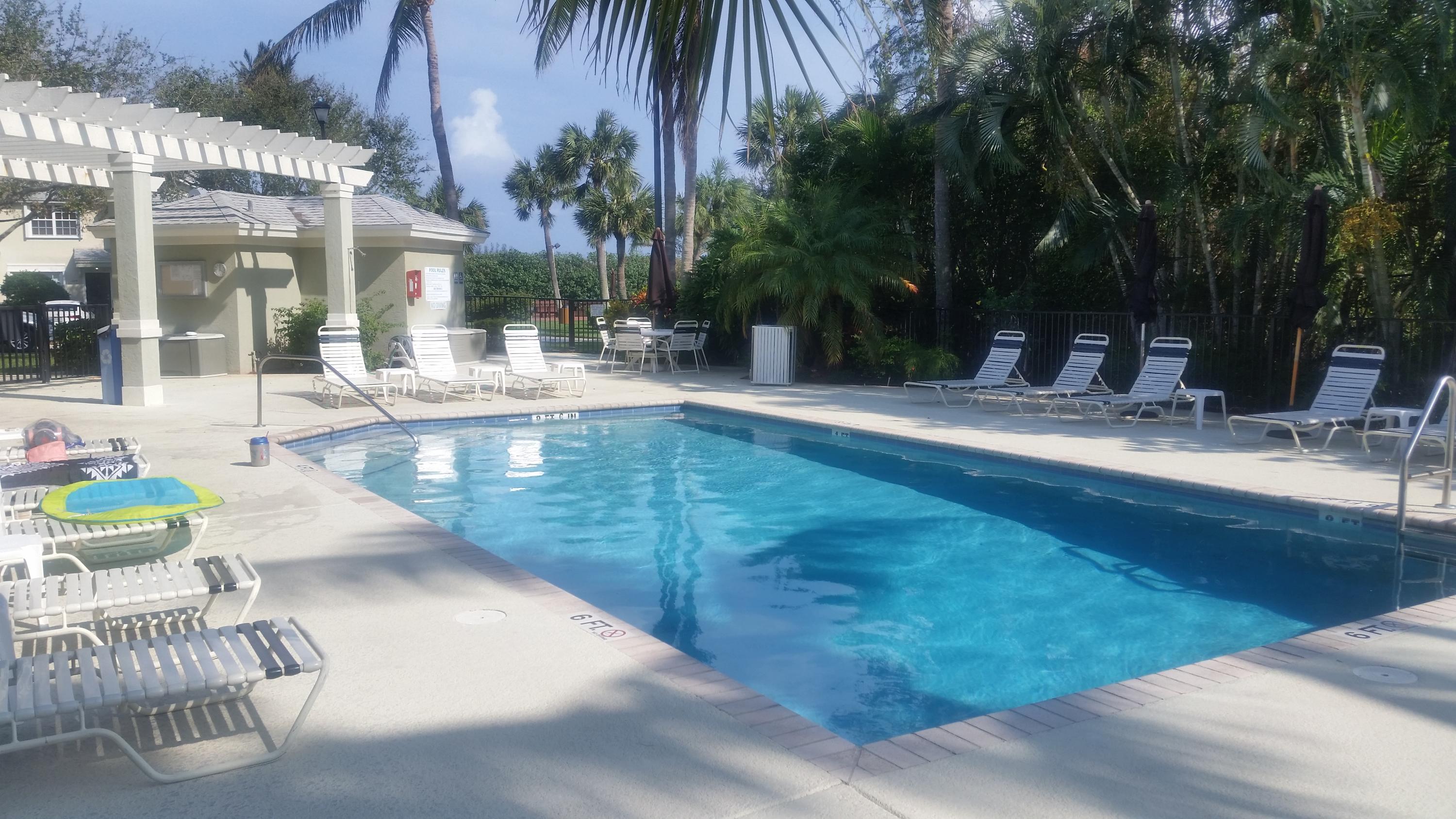 1004 Kokomo Key Lane Delray Beach, FL 33483 - Photo 14 of 21 a view of a patio with swimming pool table and chairs