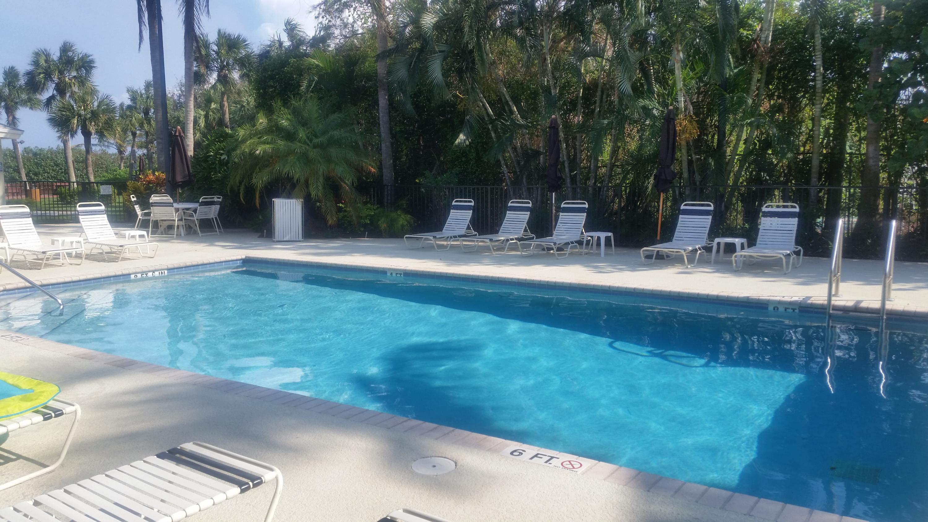1004 Kokomo Key Lane Delray Beach, FL 33483 - Photo 15 of 21 a view of a backyard and a tree