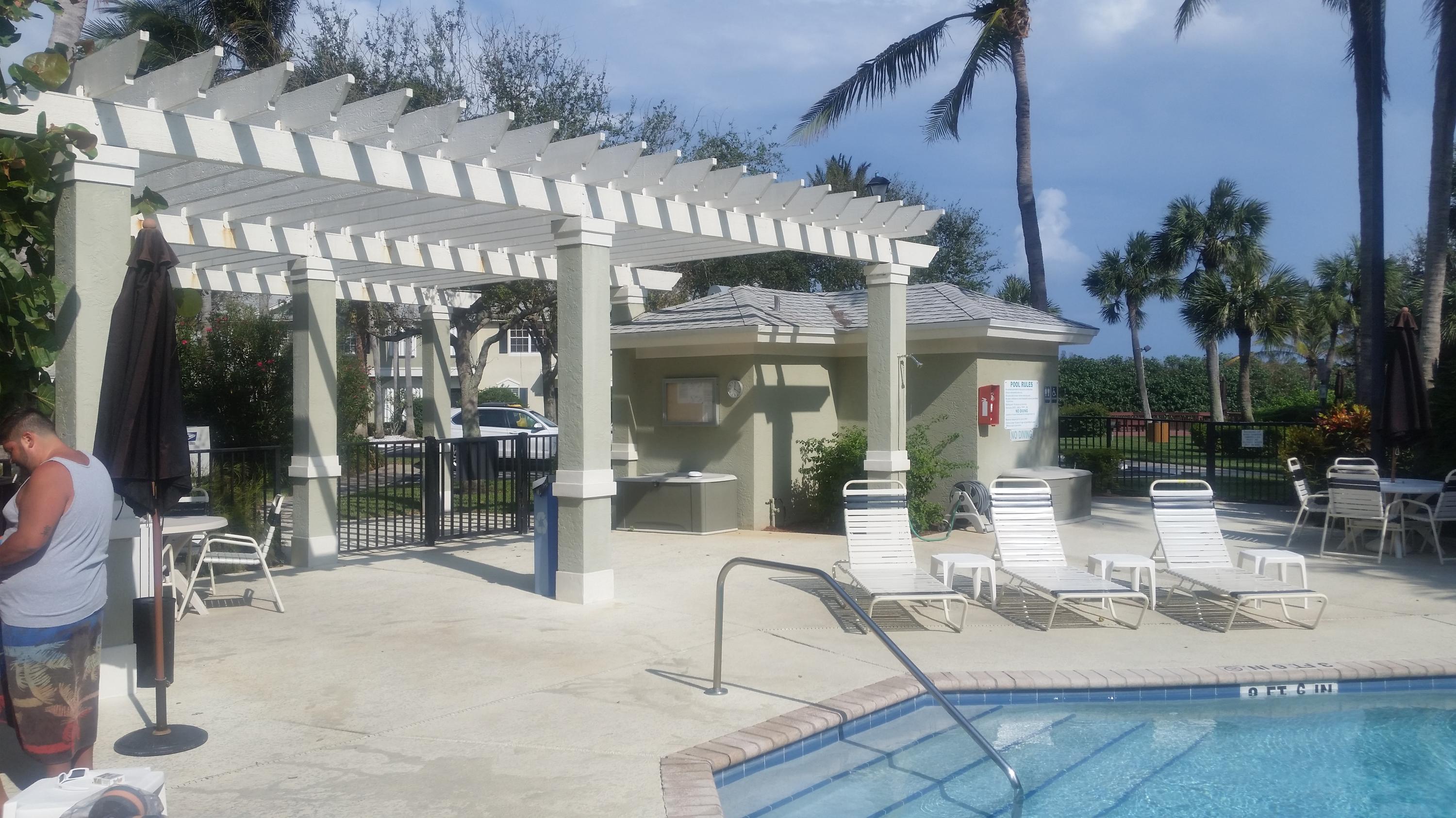 1004 Kokomo Key Lane Delray Beach, FL 33483 - Photo 2 of 21 a view of a building with sitting area