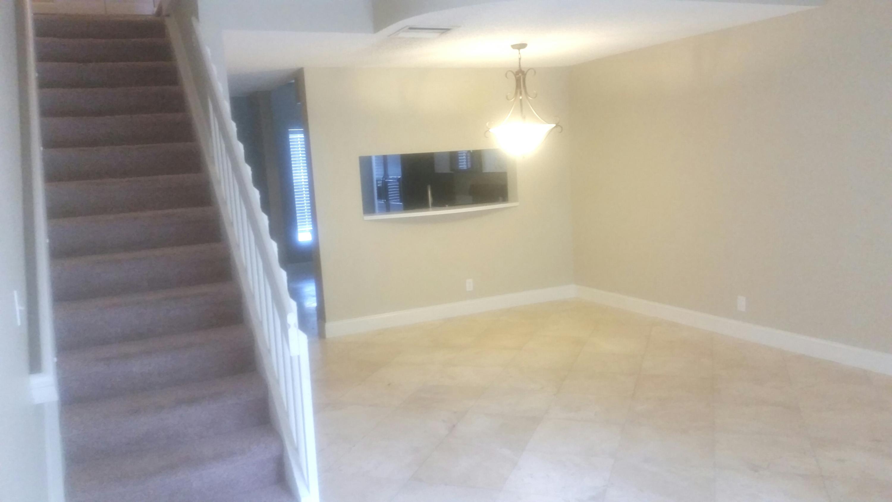 1004 Kokomo Key Lane Delray Beach, FL 33483 - Photo 5 of 21 a view of an empty room with stairs