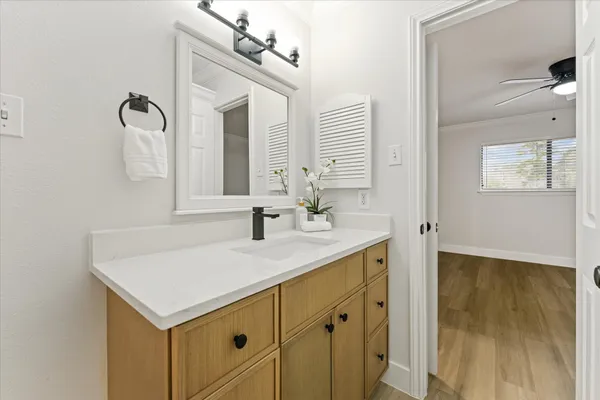 a view of a large pool with lawn chairs