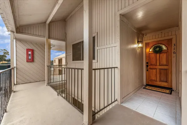 a kitchen with stainless steel appliances a stove microwave and refrigerator