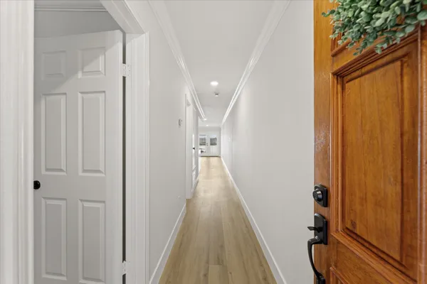 a kitchen with sink a refrigerator and cabinets
