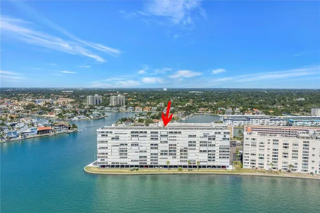 a swimming pool view with a outdoor seating space