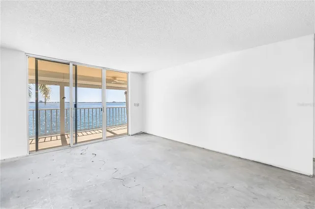 a view of a swimming pool with a table and chairs
