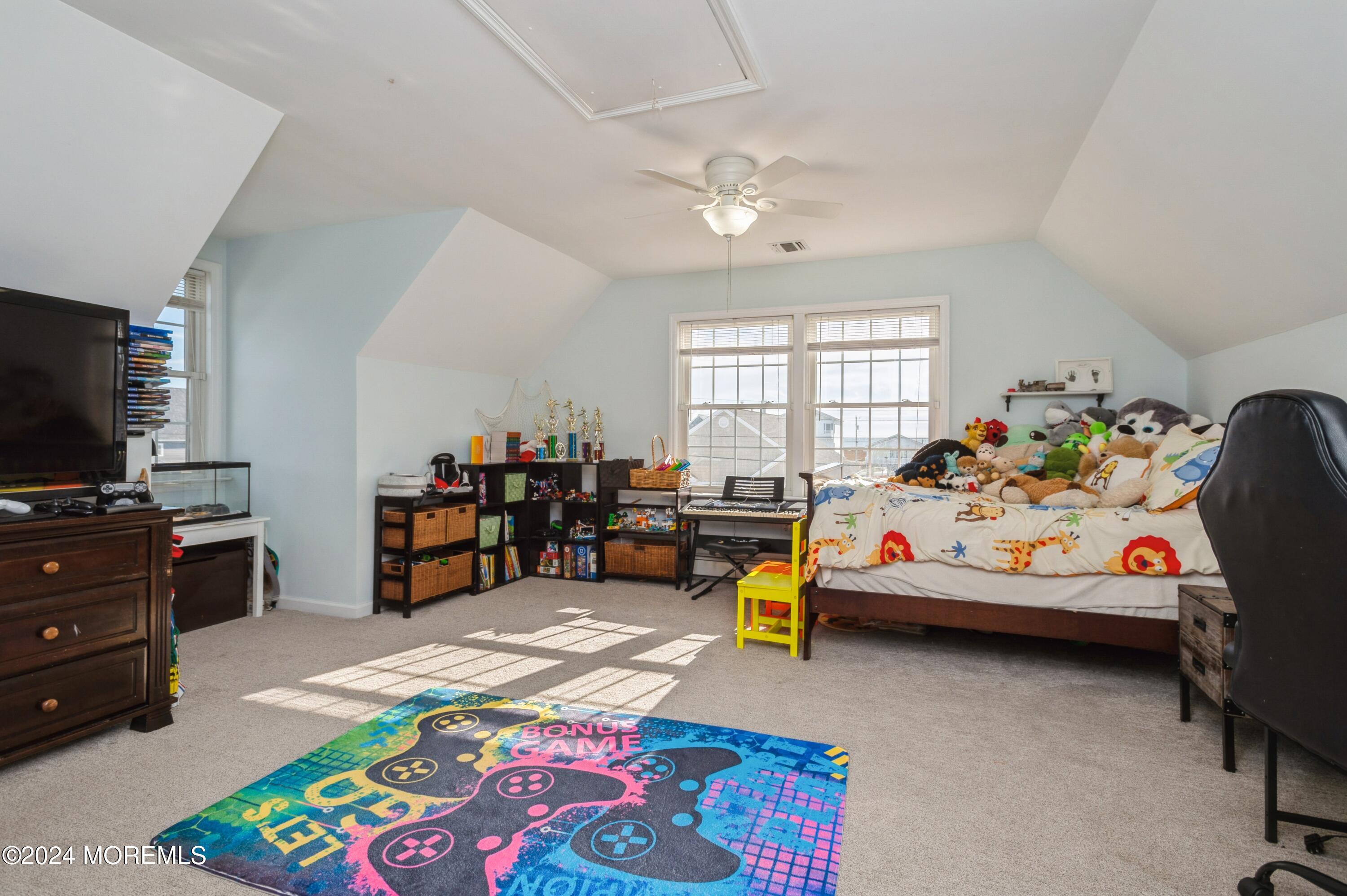 115 Curlew Road Tuckerton, NJ 08087 - Photo 16 of 36 a bedroom with furniture and a flat screen tv