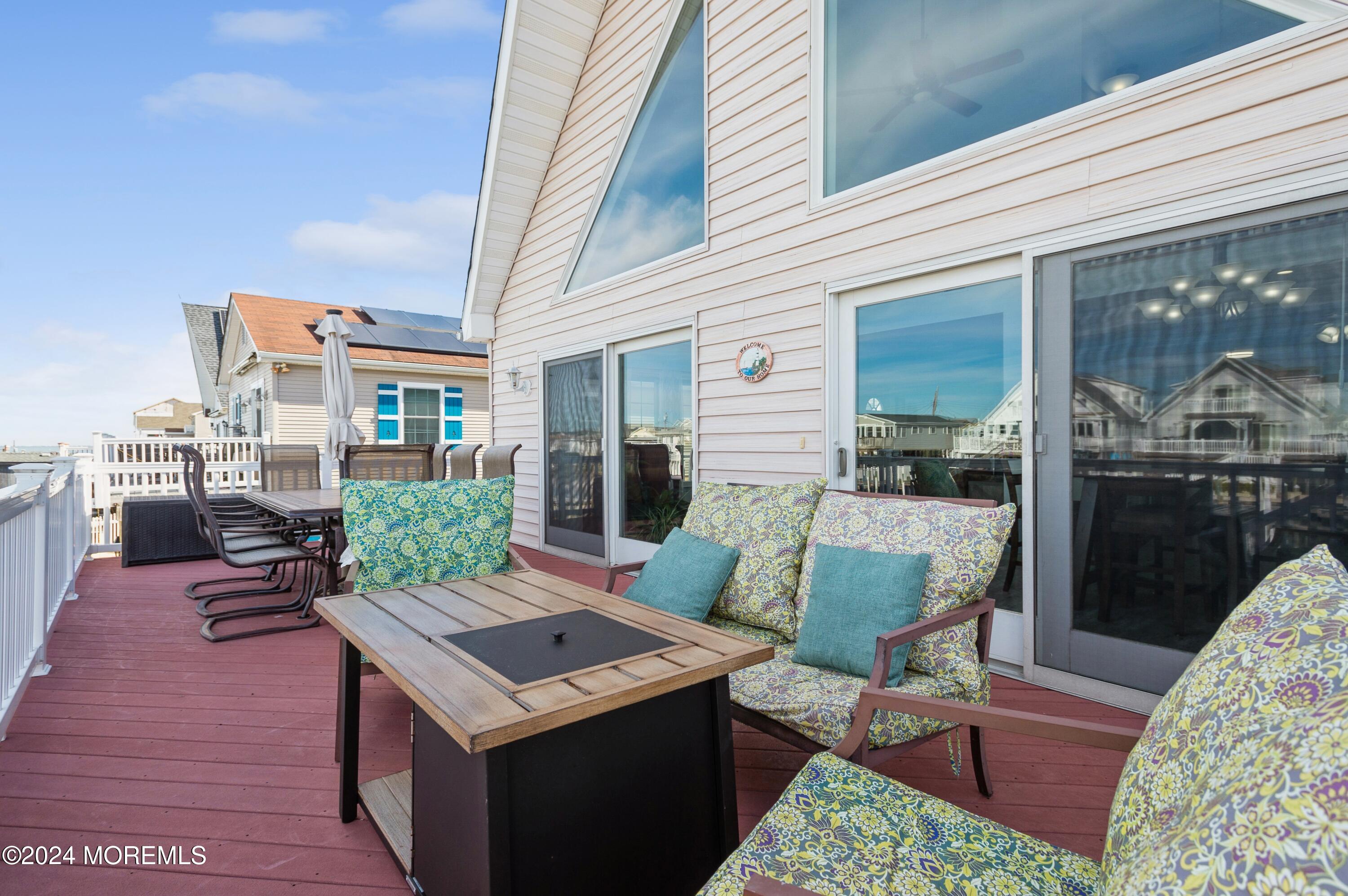 115 Curlew Road Tuckerton, NJ 08087 - Photo 19 of 36 a view of a patio with a table and chairs