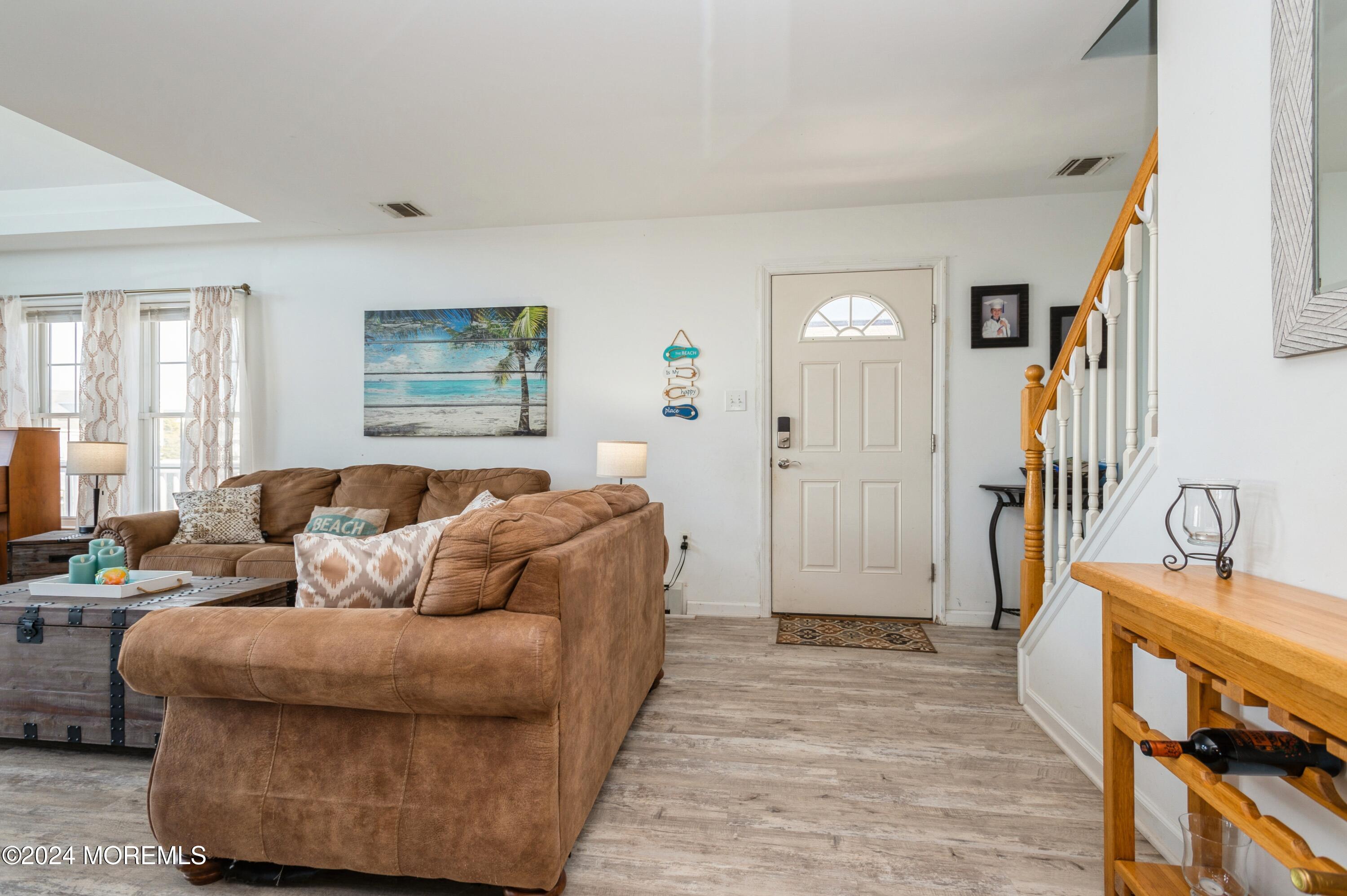 115 Curlew Road Tuckerton, NJ 08087 - Photo 2 of 36 a bedroom with a bed and wooden floor