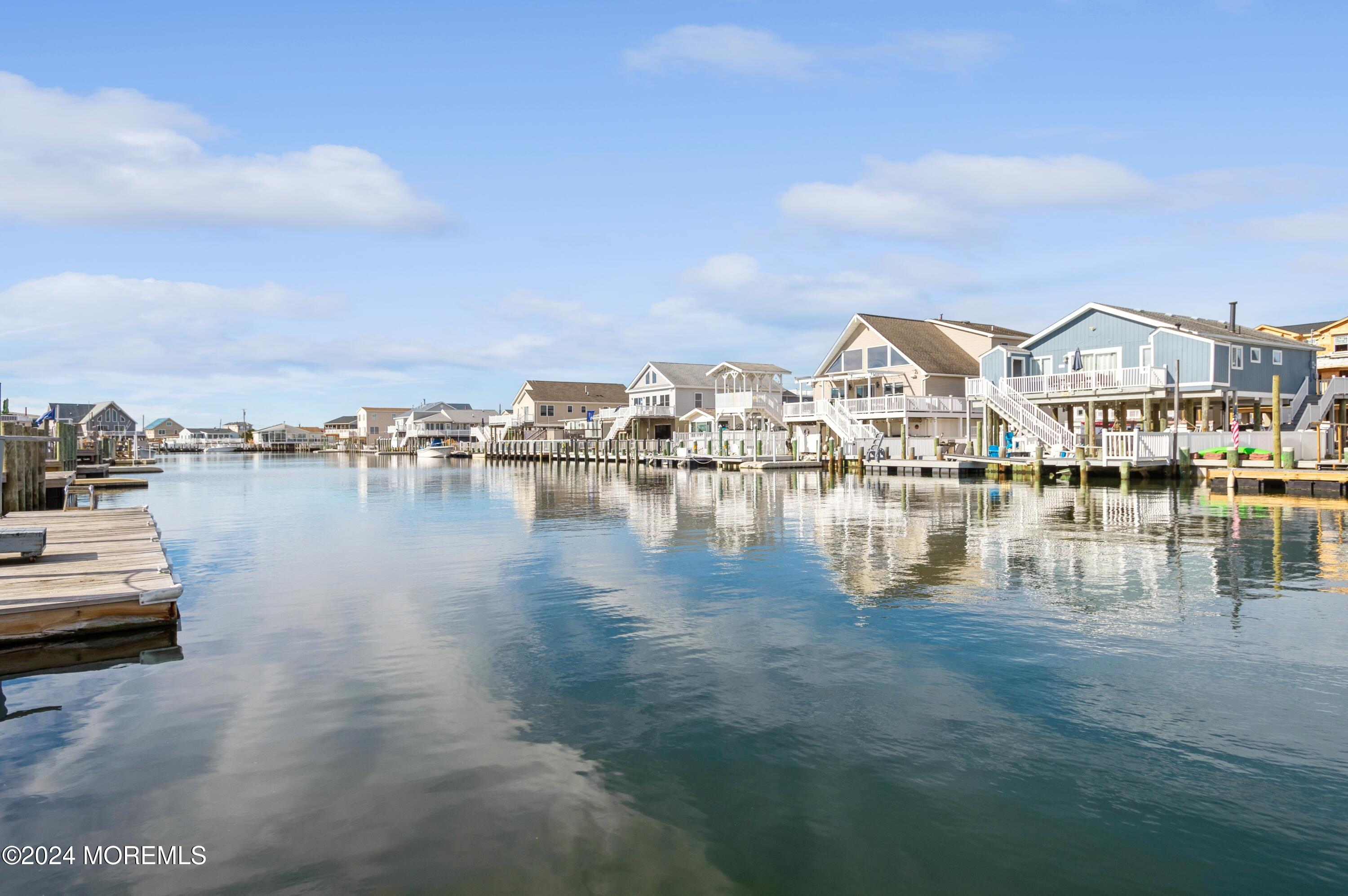 115 Curlew Road Tuckerton, NJ 08087 - Photo 24 of 36 a view of a lake with boats and trees