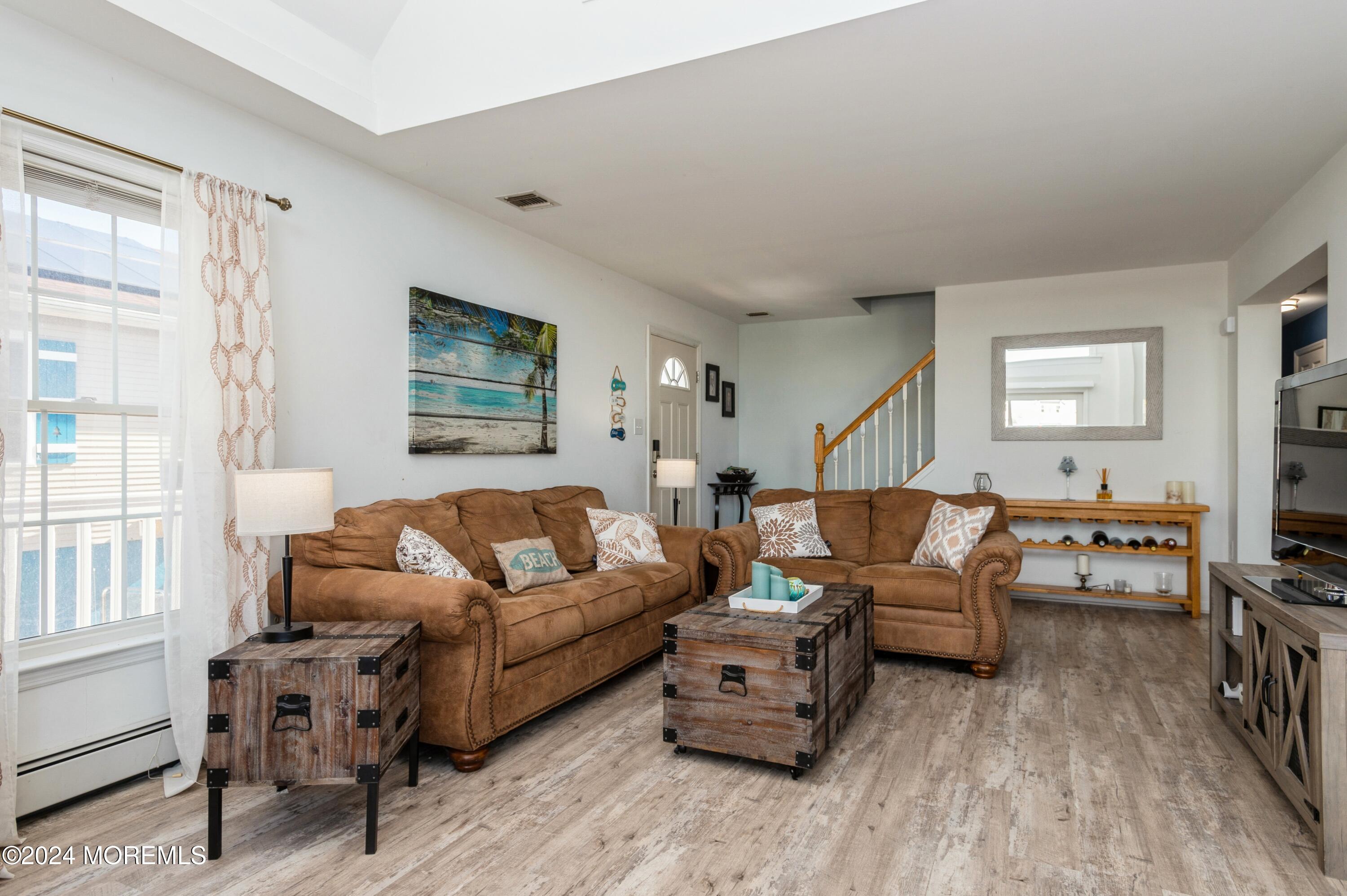 115 Curlew Road Tuckerton, NJ 08087 - Photo 5 of 36 a living room with furniture and a flat screen tv