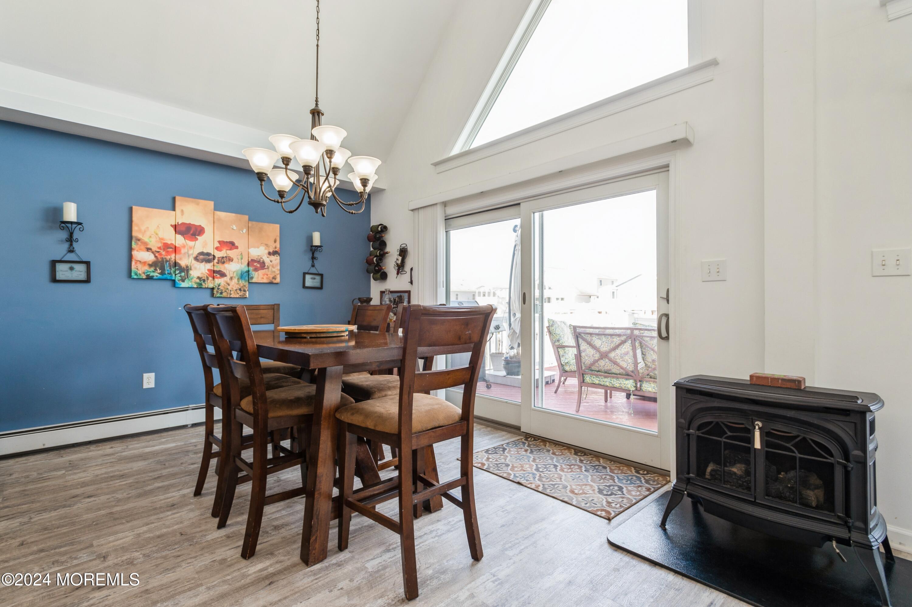 115 Curlew Road Tuckerton, NJ 08087 - Photo 8 of 36 a view of a dining room with furniture a chandelier and wooden floor