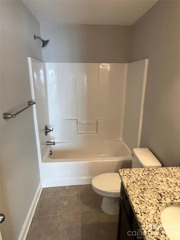 a bathroom with a bathtub and sink