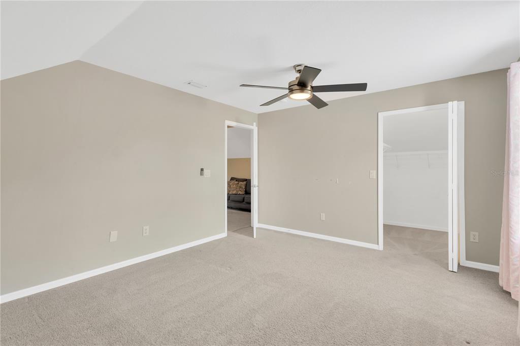 10814 Newbridge Drive Riverview, FL 33579 - Photo 22 of 44 a view of a big room with a ceiling fan and a window