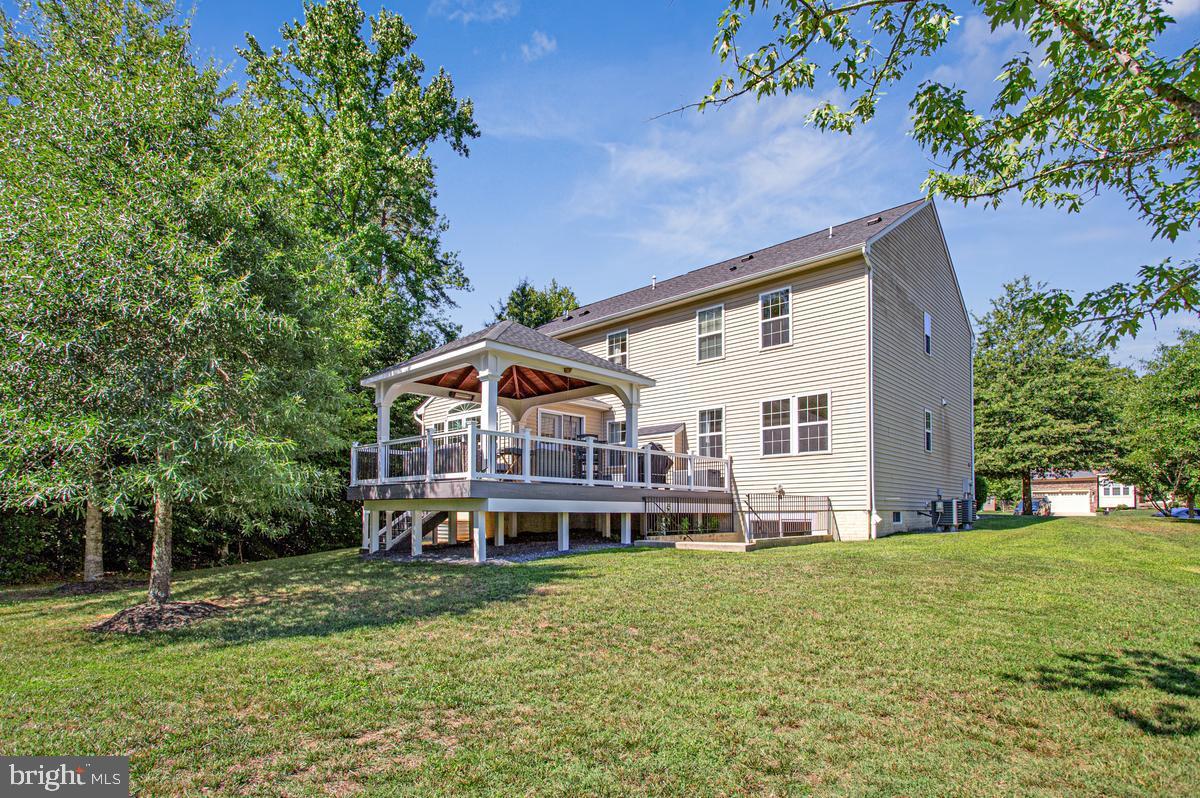 8704 Alexa Road Clinton, MD 20735 - Photo 40 of 42 Peaceful backyard with deck and wooded views