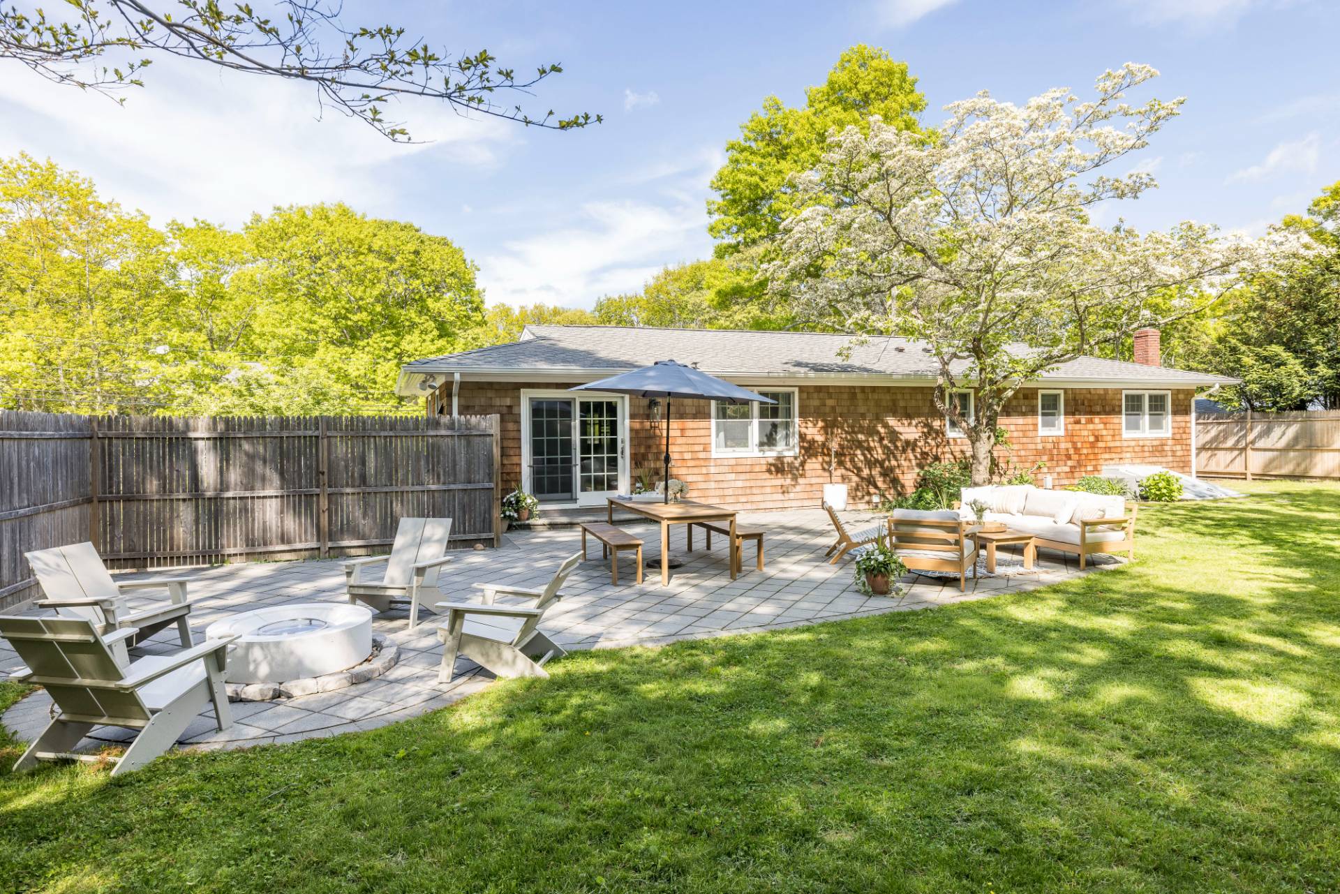 40 Ridge Road West Sag Harbor, NY 11963 - Photo 18 of 27 a view of a house with backyard sitting area and garden