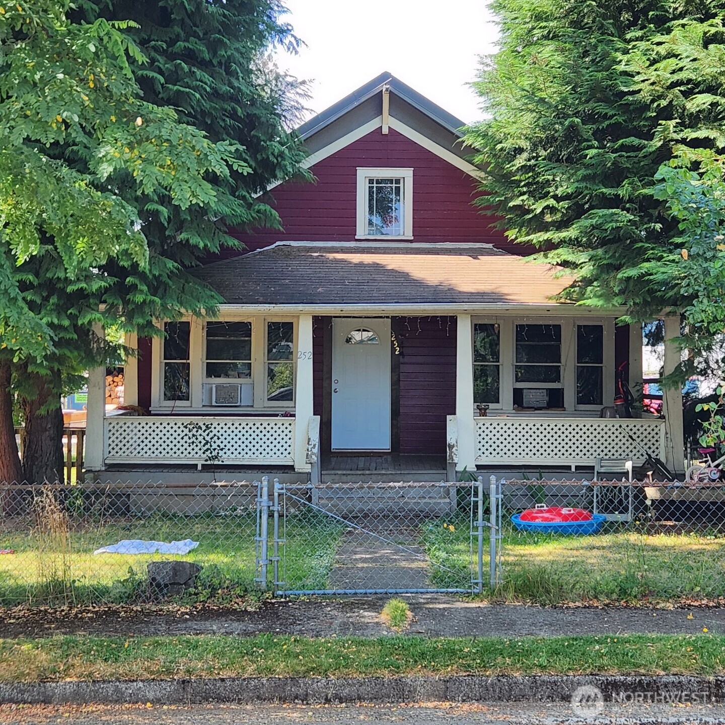 252 4th Street Morton, WA 98356 - Photo 1 of 17 a front view of a house with garden