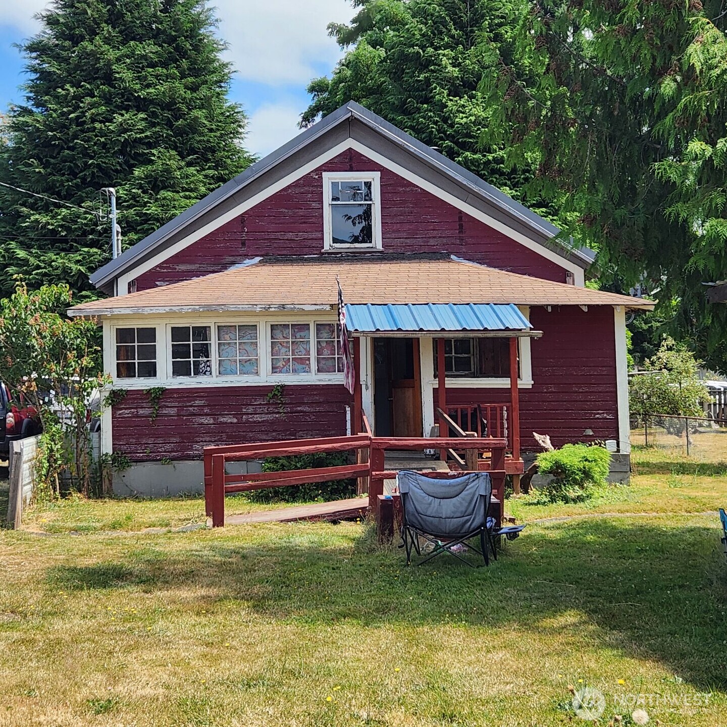 252 4th Street Morton, WA 98356 - Photo 16 of 17 a front view of a house with a garden and swimming pool