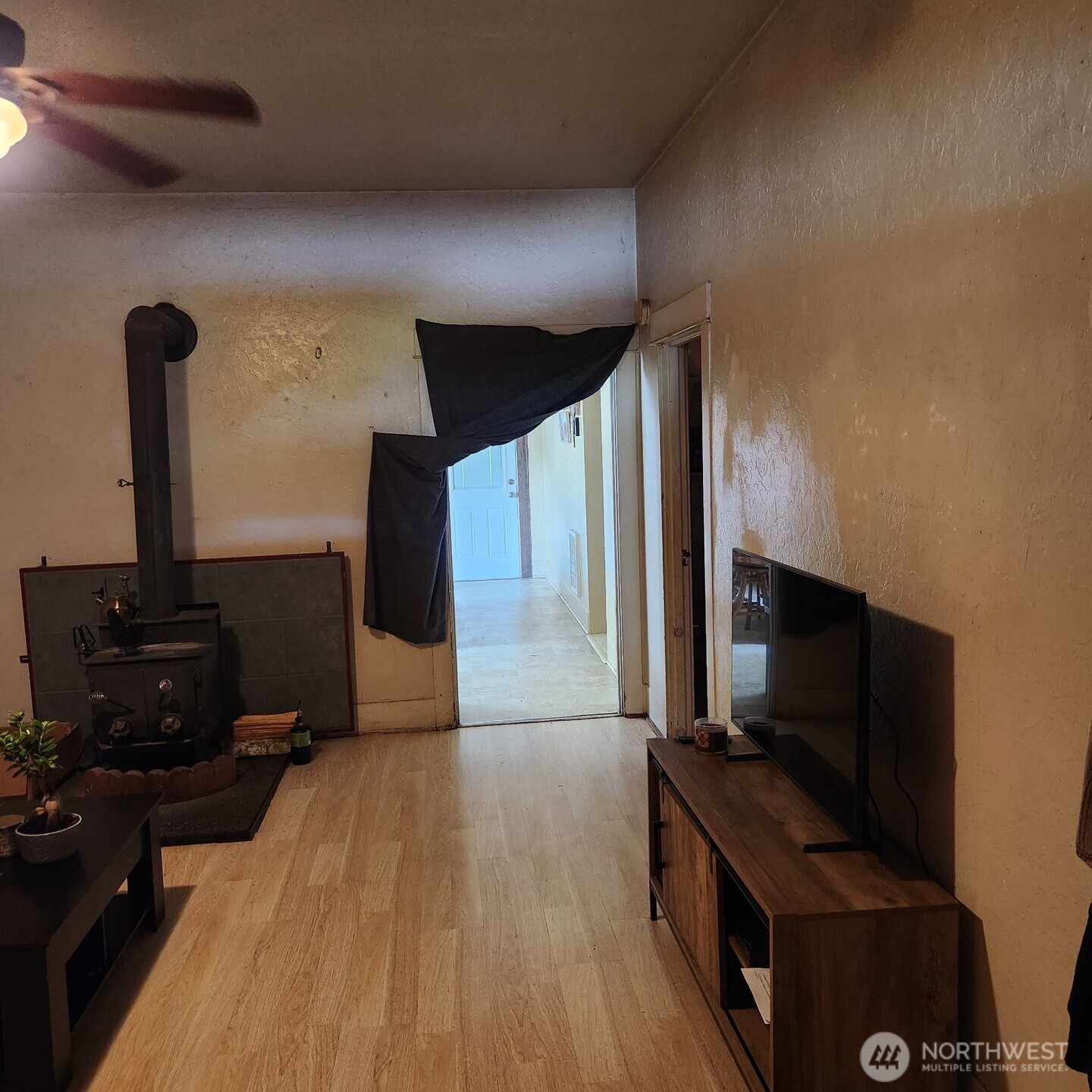 252 4th Street Morton, WA 98356 - Photo 3 of 17 a living room with hard wood floors and a flat screen tv