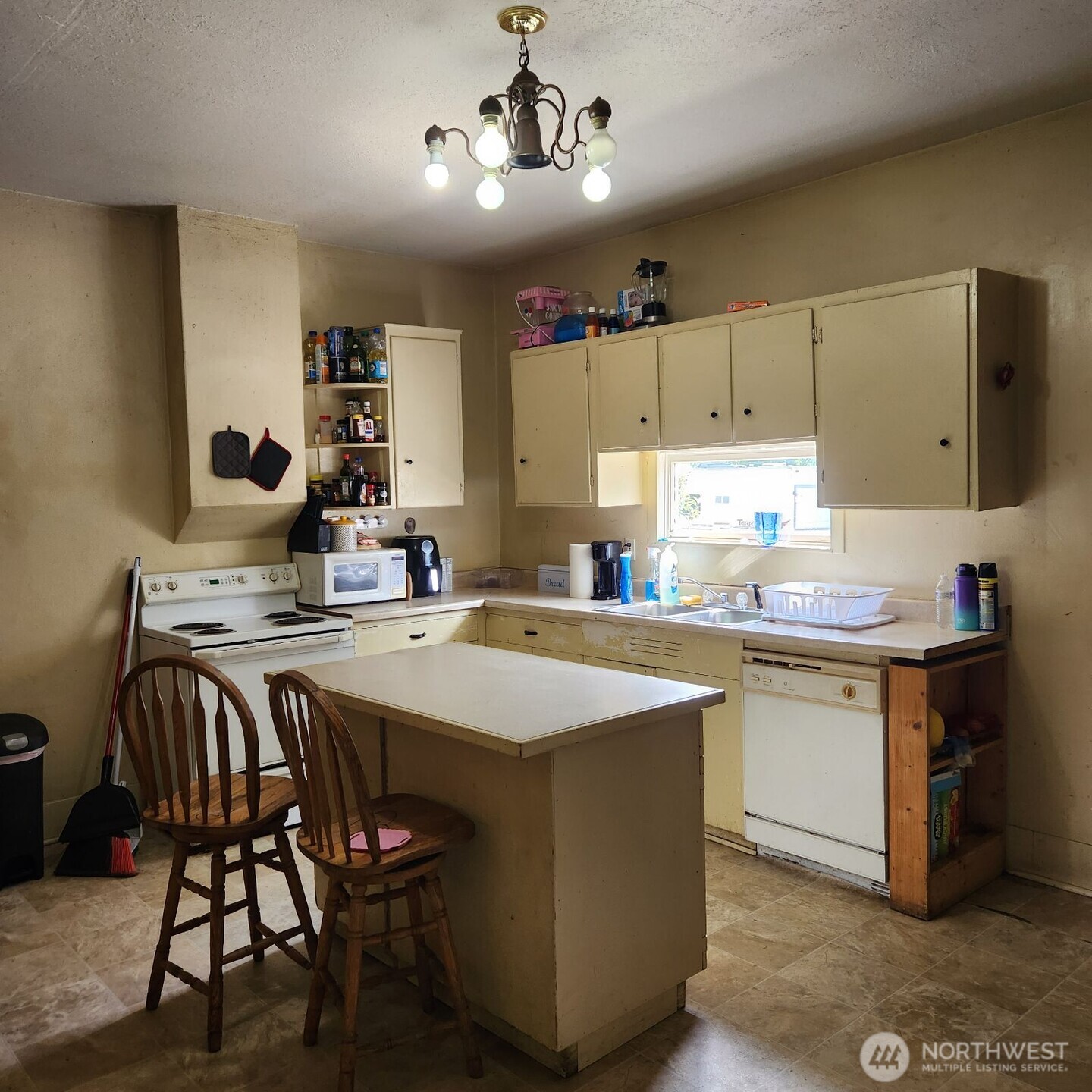 252 4th Street Morton, WA 98356 - Photo 5 of 17 a kitchen with stainless steel appliances granite countertop a sink a stove and a refrigerator