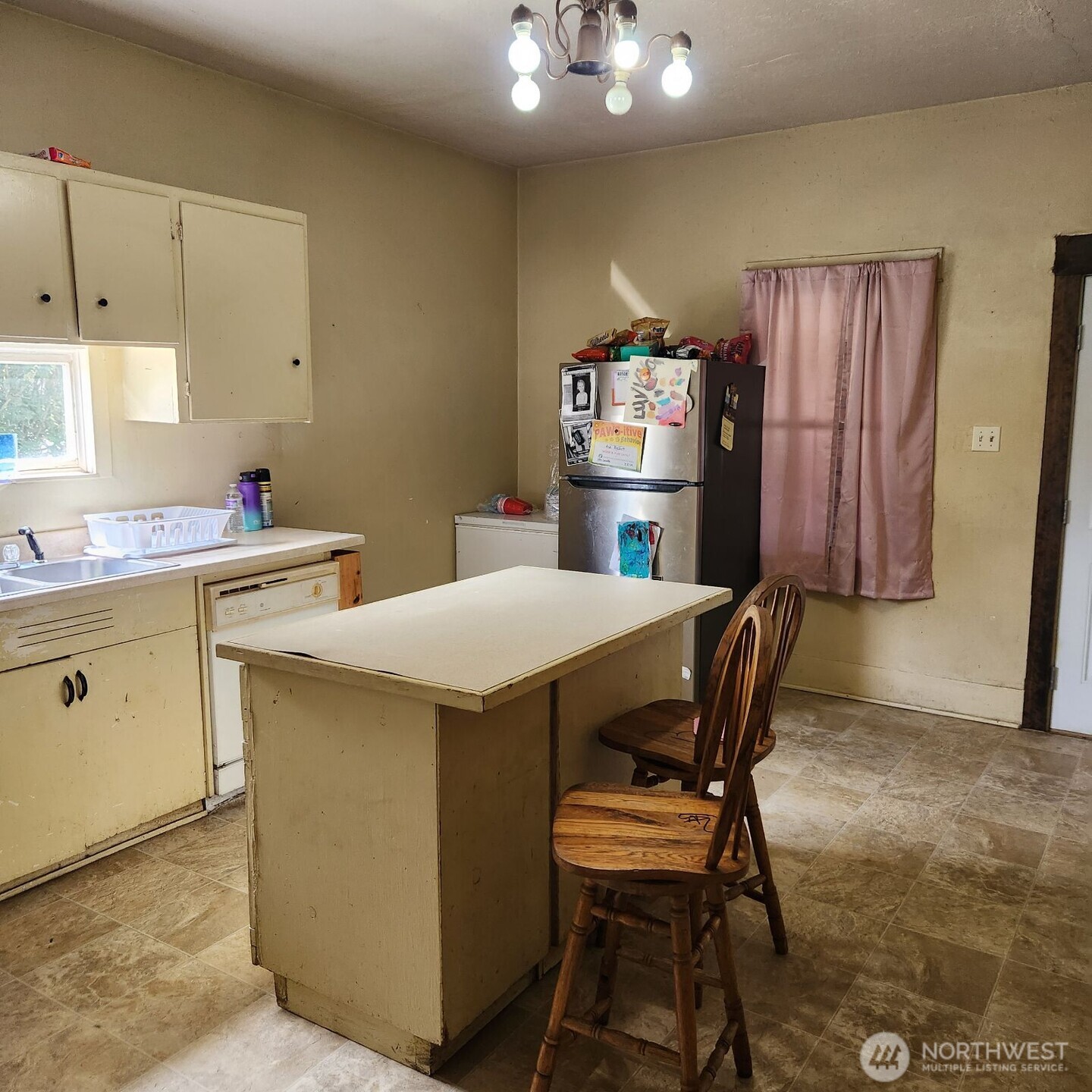 252 4th Street Morton, WA 98356 - Photo 6 of 17 a view of a dining room with furniture and window