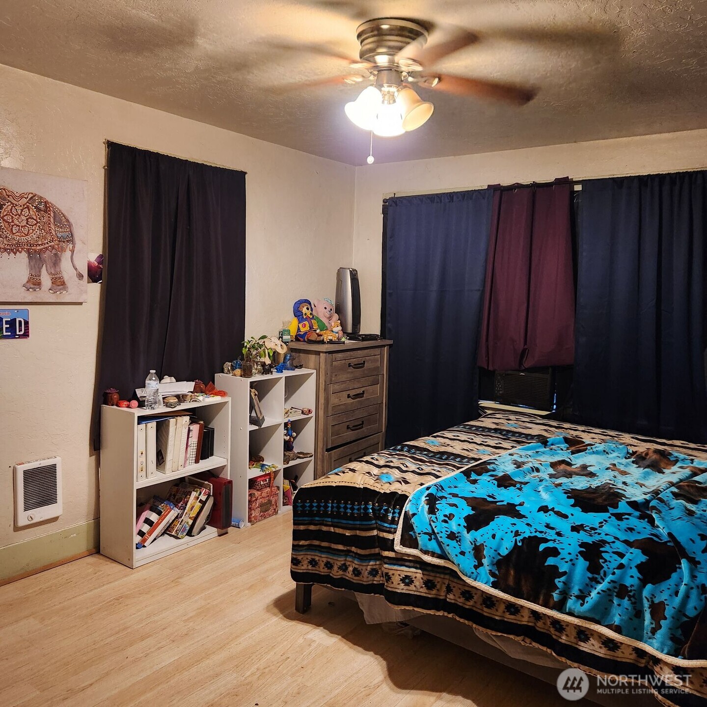 252 4th Street Morton, WA 98356 - Photo 8 of 17 a bedroom with a bed and a chandelier