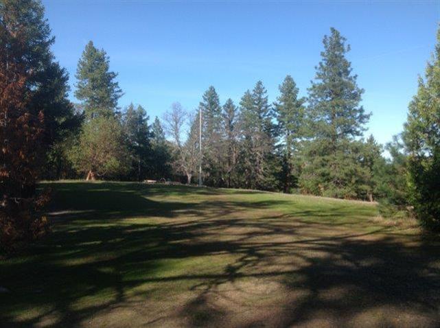 9050 Hillcrest Road Eagle Point, OR 97524 - Photo 21 of 22 a view of a golf course with a lake