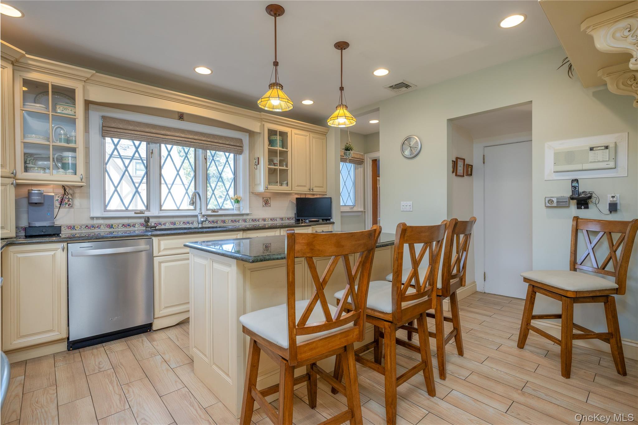 159 Fenimore Road New Rochelle, NY 10804 - Photo 11 of 37 Renovated Chef's kitchen with pendant lights, island seating, stainless applicances