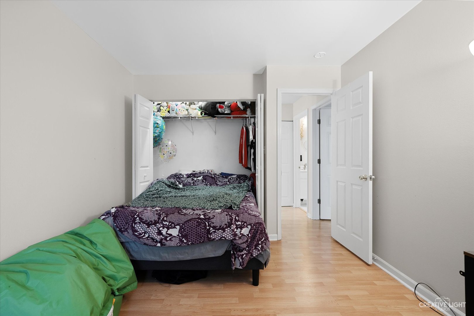 1900 Light Road, Unit 204 Oswego, IL 60543 - Photo 12 of 15 a bedroom with a bed and a window