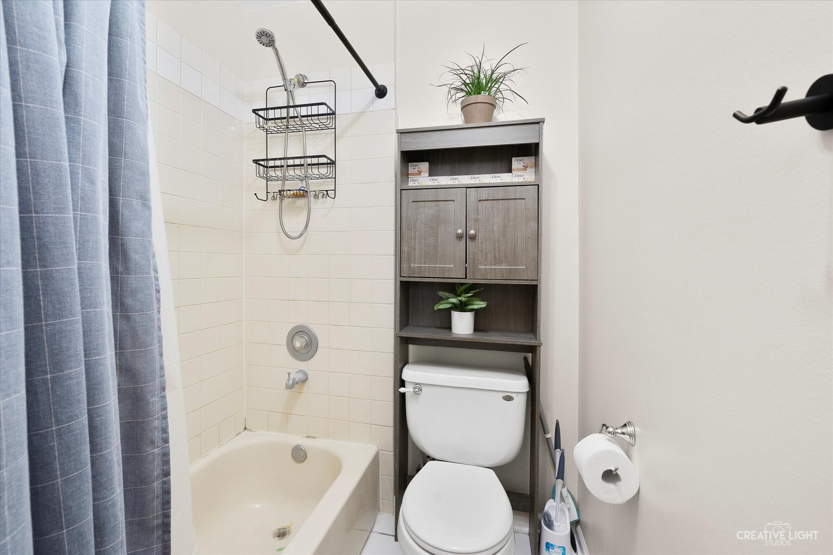 1900 Light Road, Unit 204 Oswego, IL 60543 - Photo 14 of 15 a bathroom with a toilet sink and shower