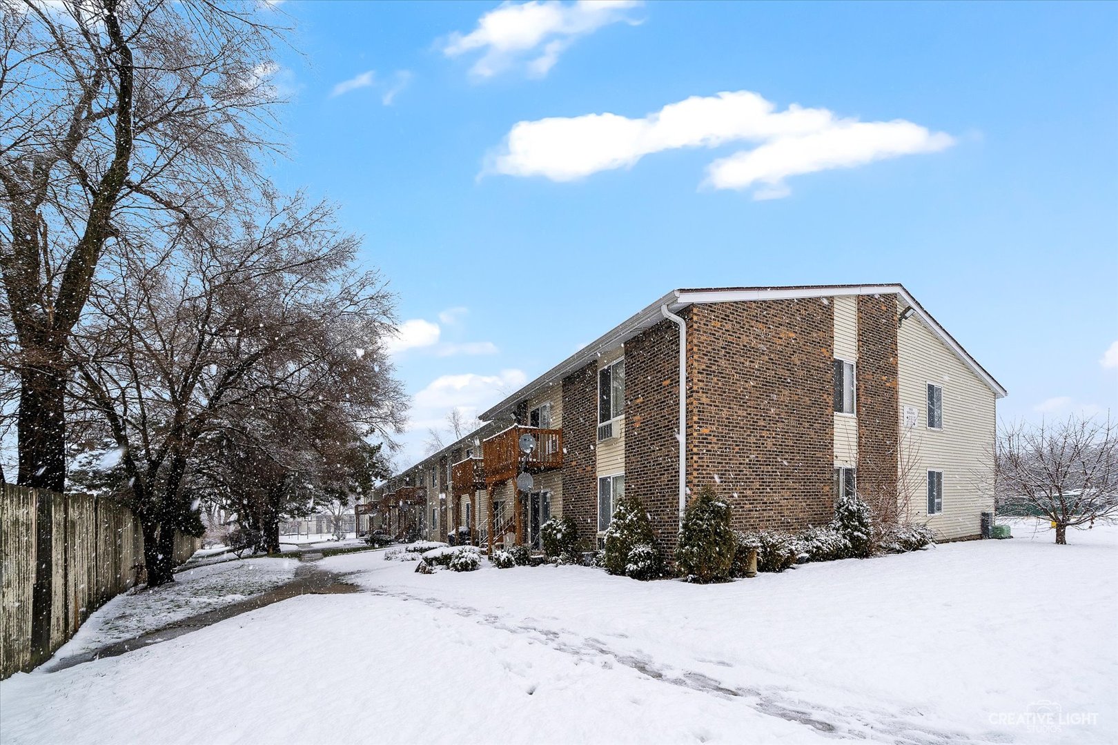 1900 Light Road, Unit 204 Oswego, IL 60543 - Photo 15 of 15 a view of a house with a snow in the yard