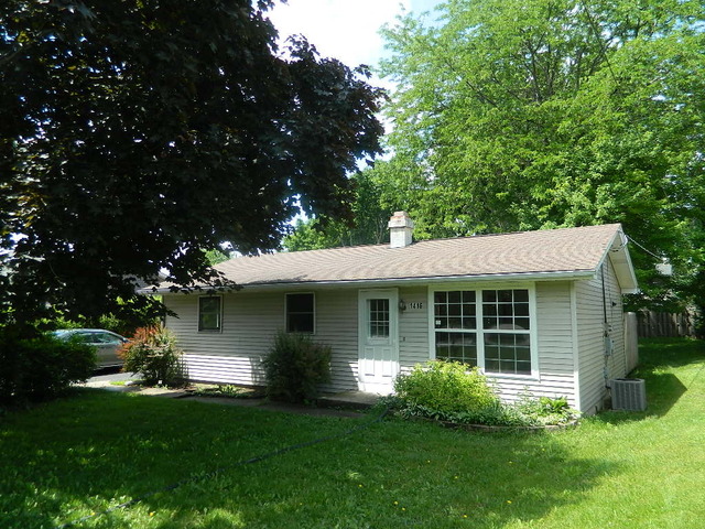 1416 Hainesville Road Round Lake Beach, IL 60073 - Photo 1 of 7 a front view of a house with garden and porch