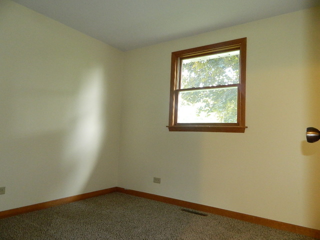 1416 Hainesville Road Round Lake Beach, IL 60073 - Photo 4 of 7 an empty room with a window