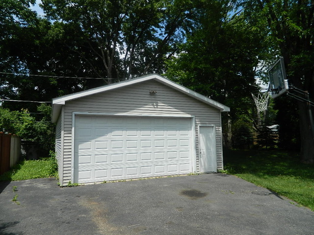1416 Hainesville Road Round Lake Beach, IL 60073 - Photo 7 of 7 a front view of a house with a garage