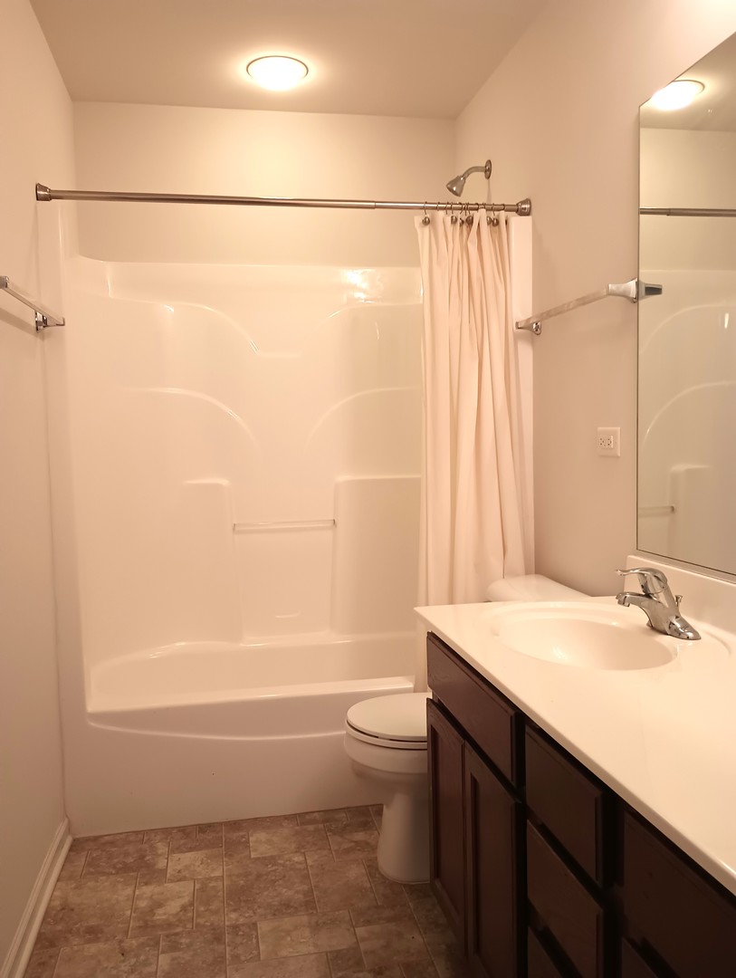 777 West Mystic Lane Romeoville, IL 60446 - Photo 26 of 35 a bathroom with a sink a toilet and shower