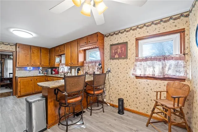 a dining room with furniture and window