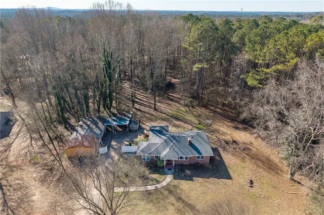 a view of a town with trees in the background