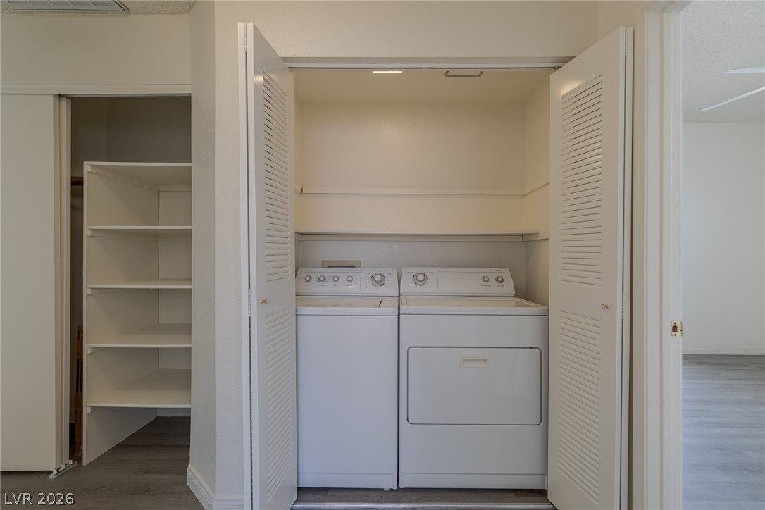 2803 Mirage Road Henderson, NV 89074 - Photo 27 of 39 Bi-fold doors open to reveal a dedicated laundry closet complete with built-in storage shelving.
