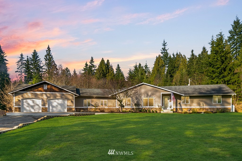 101 North Lake Roesiger Road Snohomish, WA 98290 - Photo 1 of 39 a view of house with garden and tall trees