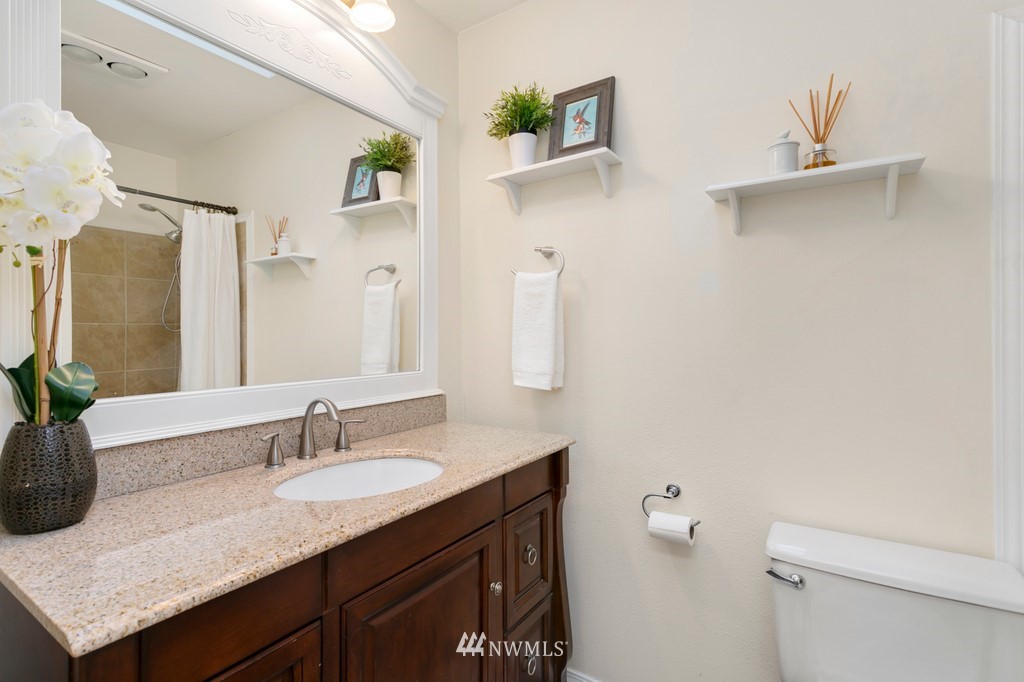 101 North Lake Roesiger Road Snohomish, WA 98290 - Photo 23 of 39 a bathroom with a granite countertop sink and a mirror