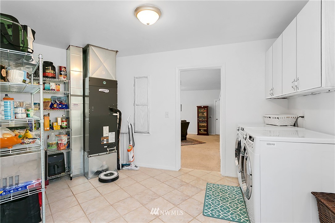 101 North Lake Roesiger Road Snohomish, WA 98290 - Photo 24 of 39 a view of utility room with fridge and closet