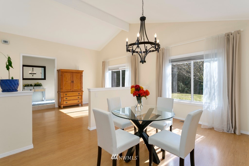 101 North Lake Roesiger Road Snohomish, WA 98290 - Photo 7 of 39 a view of a dining room with furniture window and wooden floor
