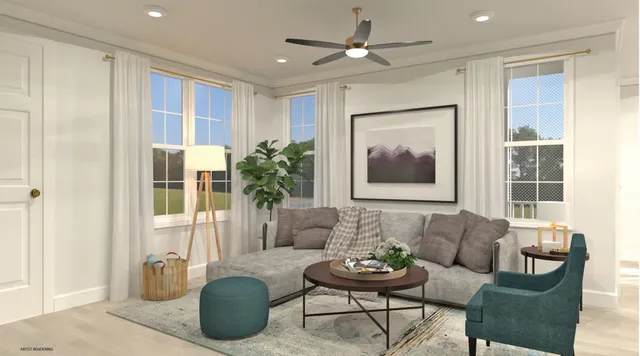 a living room with furniture and a large window