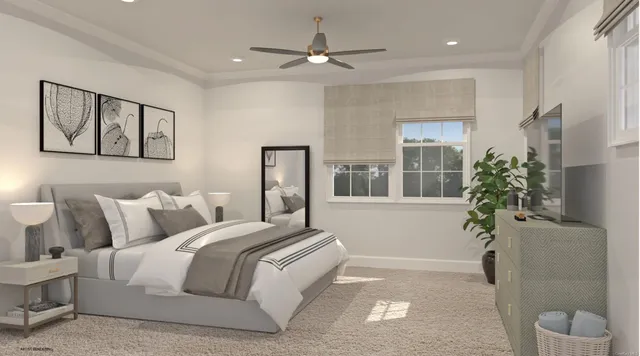 a spacious bedroom with a large bed and a potted plant