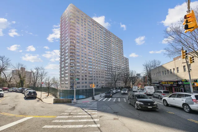 a view of outdoor space with cars parked