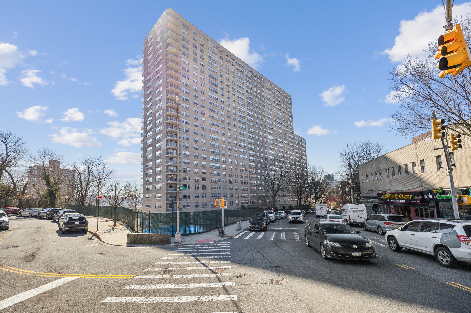 a view of outdoor space with cars parked