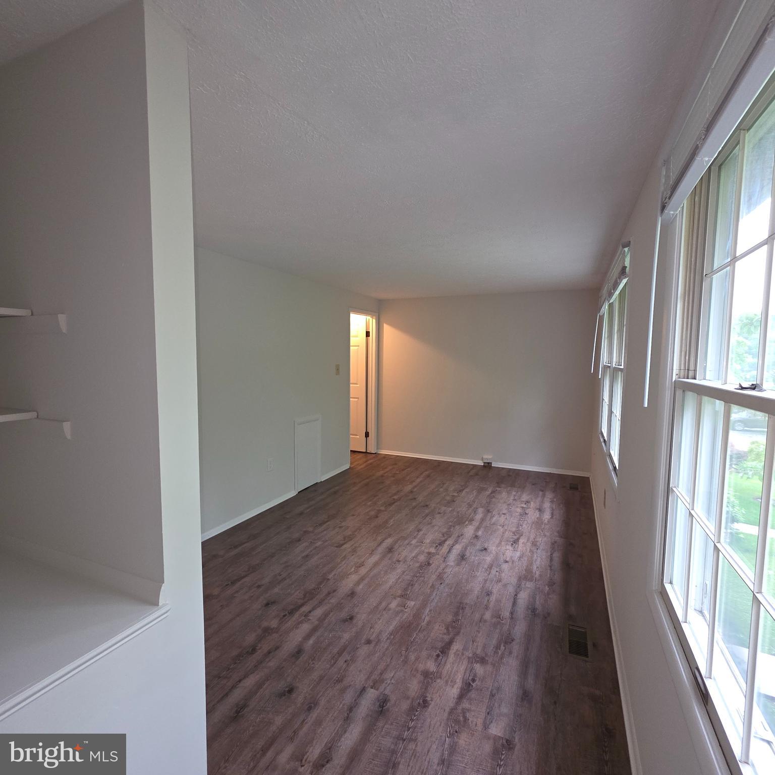 1758 Springfield Lane Frederick, MD 21702 - Photo 28 of 31 wooden floor in an empty room with a window