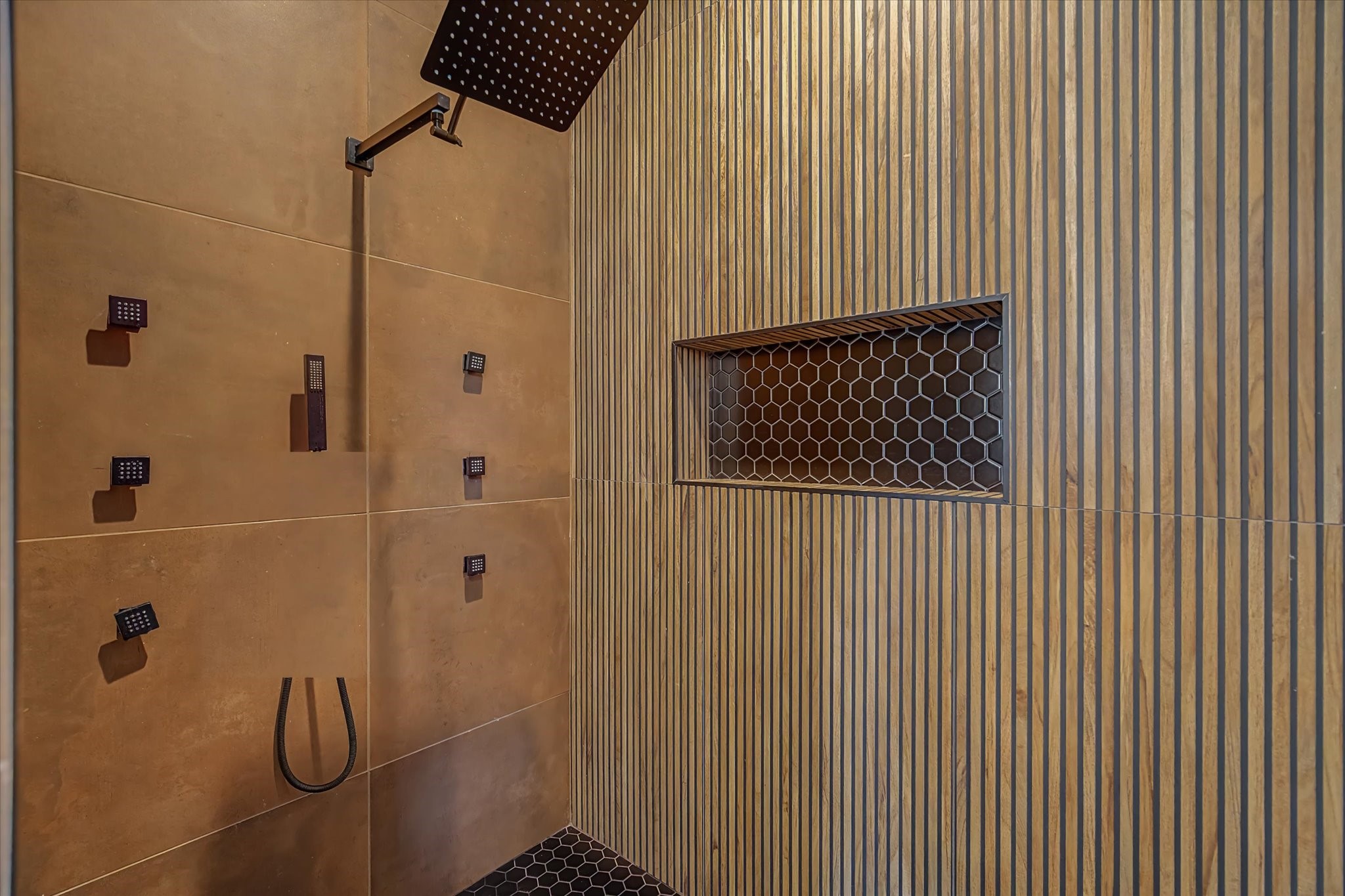 3806 Dreyfus Street Houston, TX 77021 - Photo 28 of 48 Spacious walk-in shower featuring a custom-built recessed niche for convenient storage of shower essentials.