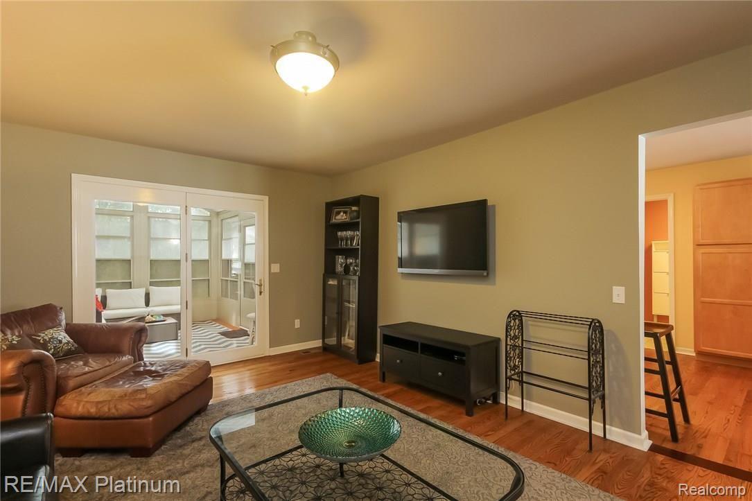 4047 Timberview Drive Howell, MI 48843 - Photo 15 of 59 Family room with french door to 3-Season room