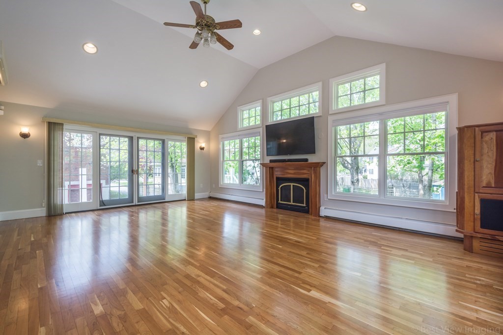 10 Chapin Road Newton, MA 02459 - Photo 15 of 35 a view of empty room with fireplace and wooden floor