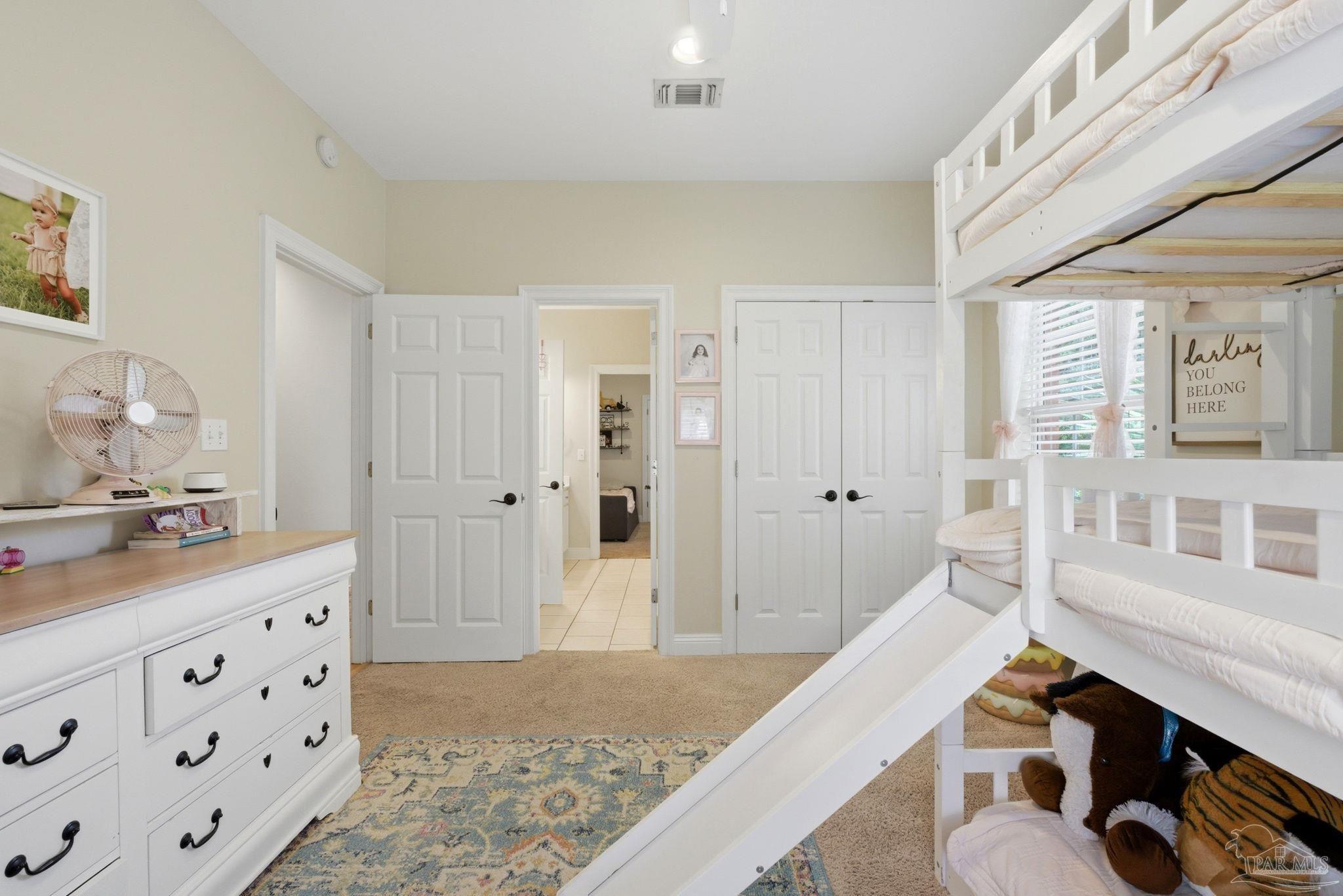 5931 Otter Point Road Pensacola, FL 32504 - Photo 25 of 67 a living room with furniture and a dresser